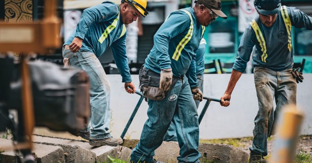 Team of construction workers collaborating on a project in San José, Costa Rica.